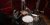 Frank Ferrer and a studio technician setting up a drum kit in a recording studio.